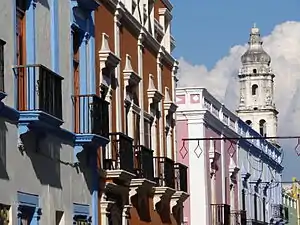 Brightly colored houses with balconies.