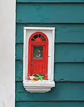 Red Shoes fairy door closeup.