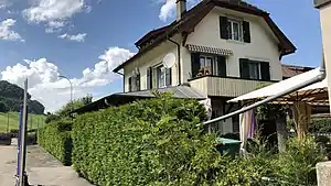 Three-story building with gabled roof