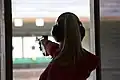 Female athlete competes in 25 meter pistol event