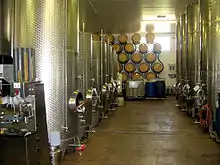 Image 26Stainless steel fermentation vessels and new oak barrels at the Three Choirs Vineyard, Gloucestershire, England (from Winemaking)