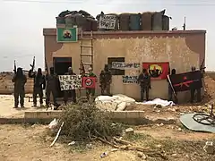 IFB and IRPGF members posing with their flags