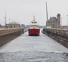 CCGS Samuel Risley starts the shipping season by breaking the ice in the Poe Lock