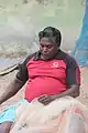 Fisherman cleaning his net in Pulicat Lake