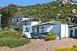 These oval-shaped cottages were built by George Goode Busch in 1918 and are the only remaining fishermen's cottages of this type in the vicinity of Saldanha.