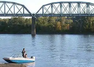 Fishermen on the Missouri River facing the Union Pacific Bridge.