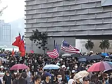 ROC flag seen alongside American flags in the 2019–20 Hong Kong protests, used as a symbol of political opposition to the PRC government.