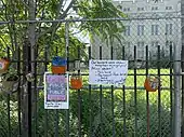 Signs and planters at the Flatbush African Burial Ground site, 2021