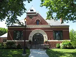 Flint Public Library (1891–92), Middleton, Massachusetts. MacDonald designed the stained glass windows at left & right.