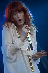 Colour photograph of Florence Welch performing live in 2010.