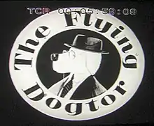 The Flying Dogtor logo - The Great Dogtor Dane appears inside a hollowed out circle adorned with the title