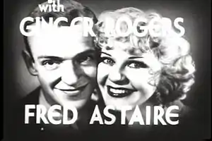 A movie trailer card featuring two performers