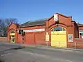 The station frontage, on the main road.