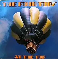 A photo of the band waving from in a hot air balloon