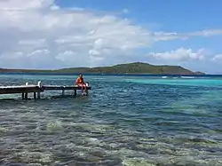 Boy on pier in Fraile