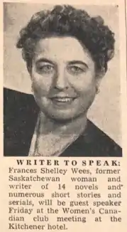 Author with short curly hair, smiling