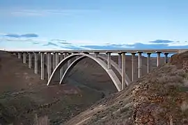 An arch bridge crossing a wide canyon