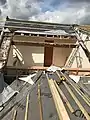 Dormer extension with tiles and felt stripped off and wood battens removed