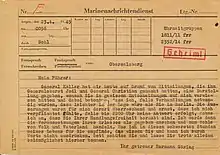 a yellowing German-language form with typewritten details and a red classification stamp