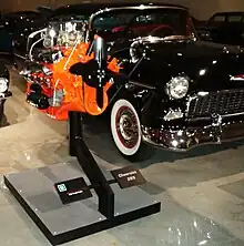 1955 Chevrolet beside the original 265cid V8 engine