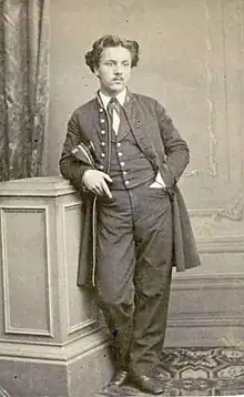 young man in 19th-century college uniform