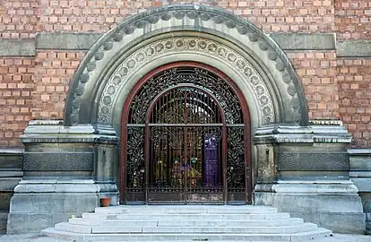 Relief sculpture and ironwork on the entrance of the gallery