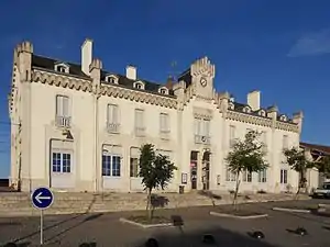 Wide two-story building with hipped roof