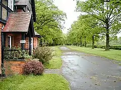 The gatehouse and driveway of Stanford Hall