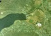 Geilston Bay, Tasmania, aerial photograph 27 Nov 2002. The Lindisfarne Golf Course site is now occupied by buildings of the Geilston Bay High School (constructed 1971-2) and its playing fields cover the area where the former quarry used to be.