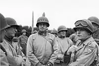 General officers including Omar Bradley and Gen. J. Lawton Collins (with goggles) attending Roosevelt's funeral.  George Patton is partially visible behind Collins.