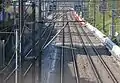 The single line 1500 V section toward Lyon on the left running alongside the 15 kV double track (on the right) toward the airport.