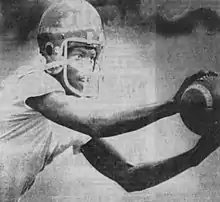 Black and white photograph of George Floyd in a football uniform wearing a helmet