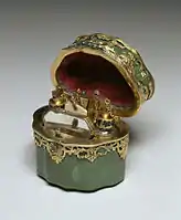 German, Toilet Case, c. 1750, "contains two glass scent bottles, a mirror, a folding ivory writing tablet, a gold bodkin, two gold toothpicks, and a miniature pair of gold tweezers".