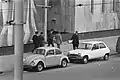 Japanese officials walking with Dutch detectives