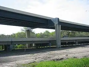 Two different girder bridges.  The top is a plate girder bridge, while the bottom is a concrete girder bridge.