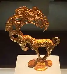 Gold stag with eagle's head, characteristic of the new style introduced by the Ordos nomads. Excavated at the southern border of the Ordos desert.