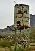 Metal railroad water tank.