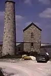 Goonvean China Clay Works: engine house with boiler-house and detached chimney