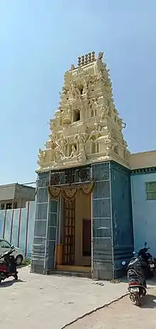 The temple's gopuram, with images of the deity carved on it.