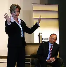 Granholm and Devos at an October 12 informal debate at the Detroit Economic Club