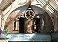 Grand Arcade Clock. Figures representing India (centre) and Wales.