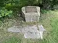 Historic District designation plaque on a piece of granite