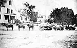 A three-car, horse-drawn train on the Granite Railway at East Milton Square c1855 (another source says c1840).