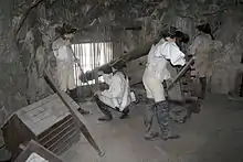 Reconstruction in the Great Siege Tunnels of British gunners using a cannon mounted on a Koehler depressing carriage