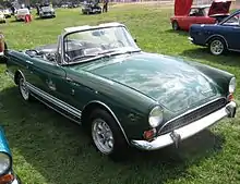 Dark-green open-top sports car