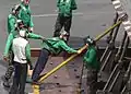 Green shirts are generally aircraft or equipment maintenance personnel.