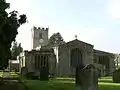 The east end of Grinton church features three windows in the Perpendicular style