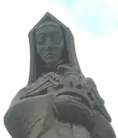 A close-up of the statue of Lady Margaret Beaufort by Dennis Huntley