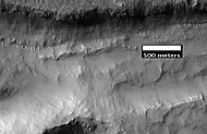 Close-up of gullies in trough, as seen by HiRISE under the HiWish program.  These are some of the smaller gullies visible on Mars.