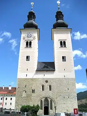 Gurk Cathedral, Austria,  has remarkably little adornment of the westwerk, and arbitrary placement of the lower windows